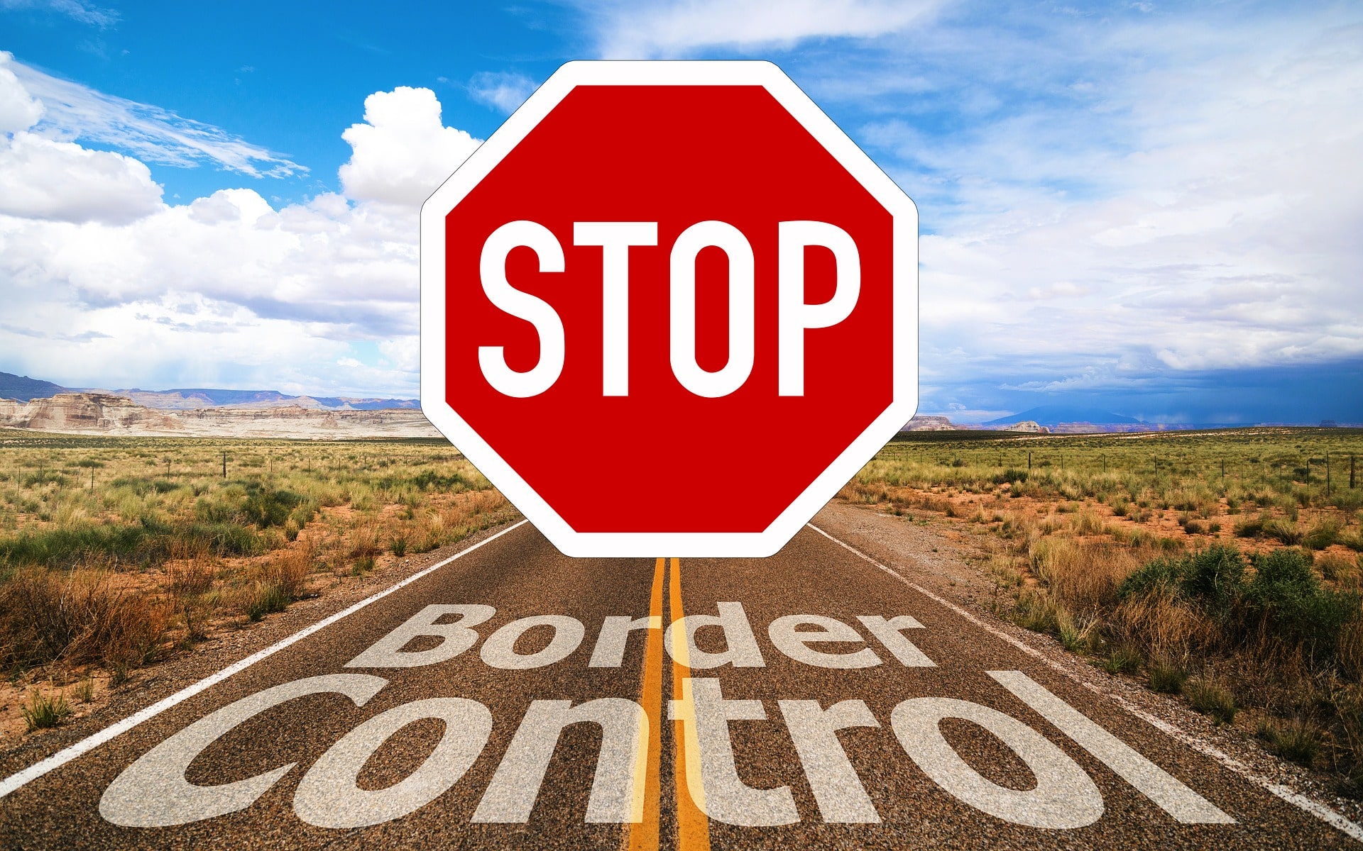 Route avec panneau disant "Stop Border Control"